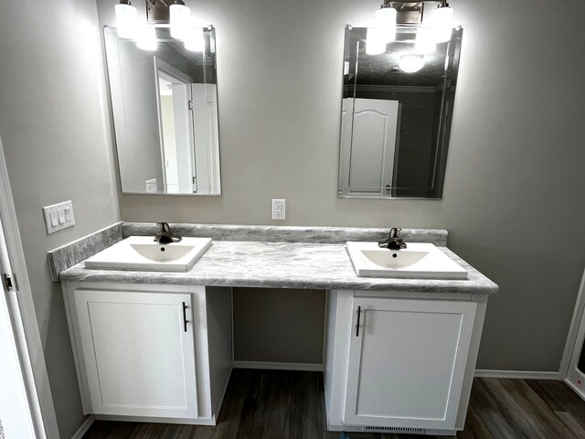 2759 Naples Ct, Lapeer, MI 48446 - bathroom featuring double vanity, wood finished floors, and a chandelier