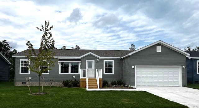 ranch-style house with a garage and a front lawn