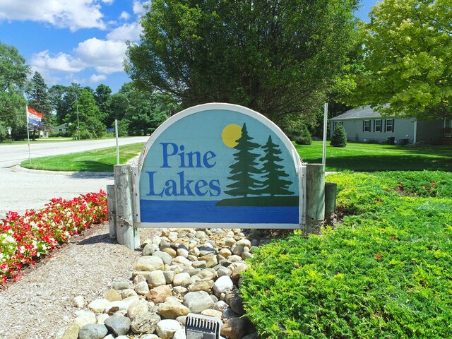 2759 Naples Ct, Lapeer, MI 48446 - community sign featuring a lawn