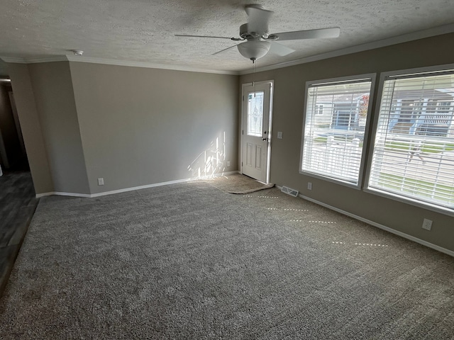 2759 Naples Ct, Lapeer, MI 48446 - carpeted empty room with a ceiling fan, crown molding, baseboards, a textured ceiling, and a smoke detector