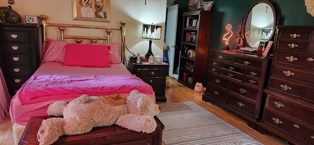 227 Joliet Ave, Houghton Lake, MI 48629 - bedroom with light wood-style flooring