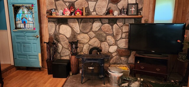 227 Joliet Ave, Houghton Lake, MI 48629 - living area featuring a wood stove and wood finished floors