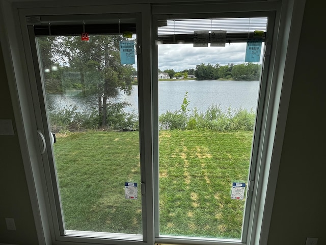 doorway to outside featuring a wealth of natural light and a water view