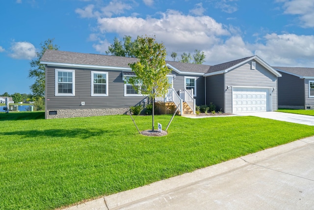 view of front of house featuring a garage and a front yard