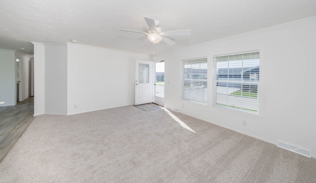 2769 Naples Ct, Lapeer, MI 48446 - unfurnished room featuring a ceiling fan, light carpet, ornamental molding, and baseboards