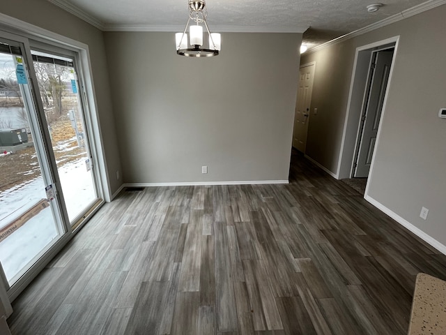 2765 Naples Ct, Lapeer, MI 48446 - unfurnished dining area with dark wood-type flooring, a chandelier, baseboards, and ornamental molding