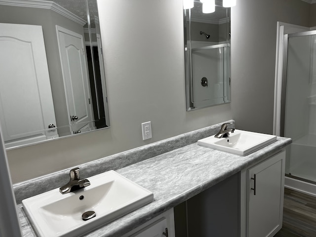 2765 Naples Ct, Lapeer, MI 48446 - full bath featuring a shower stall, ornamental molding, double vanity, and wood finished floors