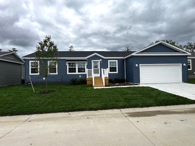 2765 Naples Ct, Lapeer, MI 48446 - single story home featuring driveway, a garage, and a front lawn