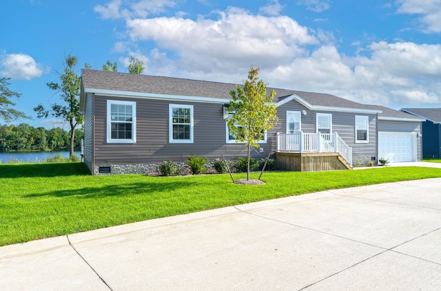 view of front facade with a garage and a front lawn