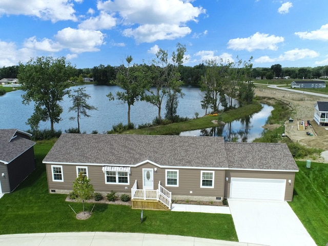 single story home featuring a garage, a water view, and a front lawn