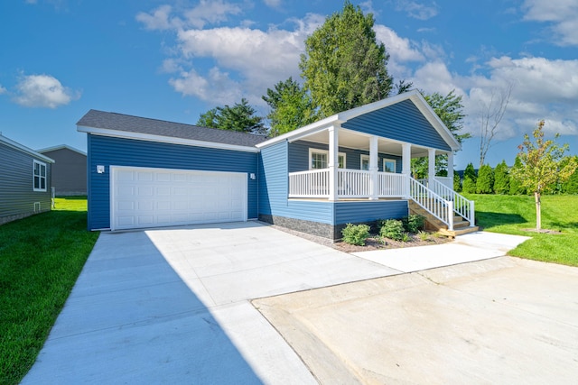 view of front of home featuring a front yard, a porch, and a garage