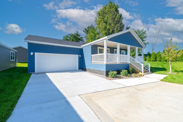 2756 Naples Ct, Lapeer, MI 48446 - view of front facade with a porch, a front lawn, concrete driveway, and a garage