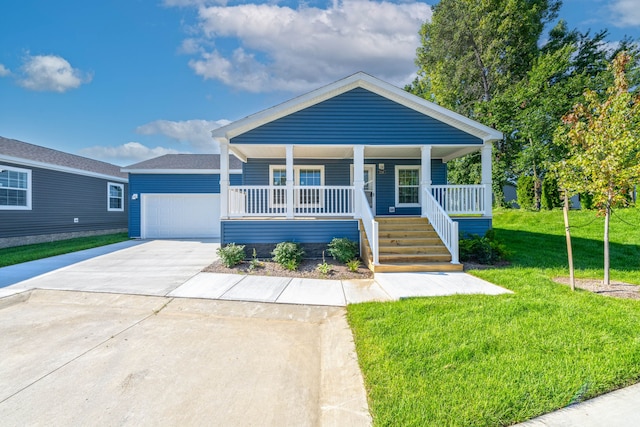 bungalow-style house featuring a front yard, a garage, and covered porch