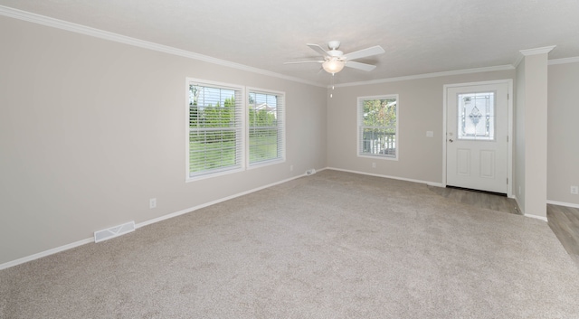 unfurnished room with light carpet, crown molding, and ceiling fan