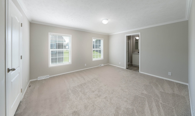 2756 Naples Ct, Lapeer, MI 48446 - unfurnished bedroom featuring crown molding, baseboards, carpet floors, a textured ceiling, and ensuite bath