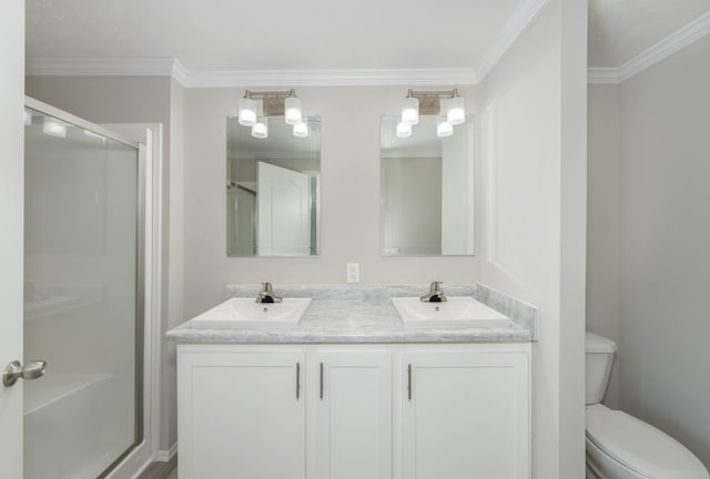 2756 Naples Ct, Lapeer, MI 48446 - bathroom with a shower stall, double vanity, toilet, and crown molding