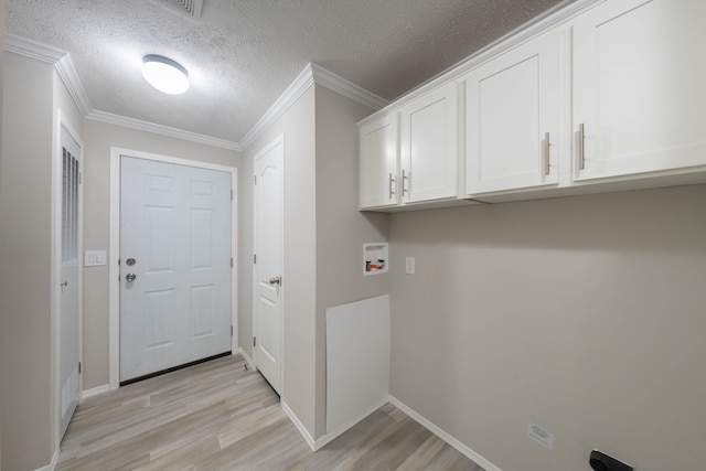 laundry room with cabinets, crown molding, washer hookup, a textured ceiling, and light hardwood / wood-style floors