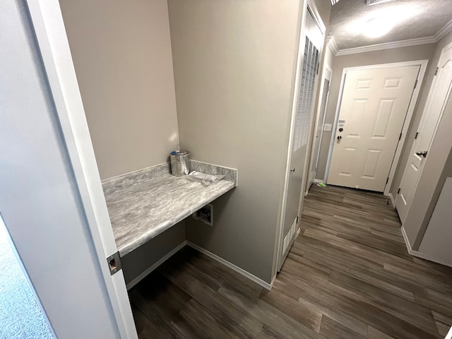 interior space with dark hardwood / wood-style floors and crown molding