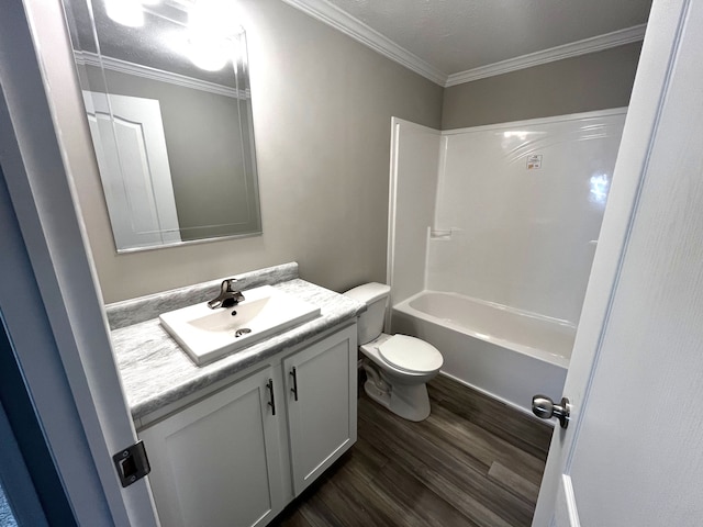 full bathroom featuring toilet, vanity, wood-type flooring, and ornamental molding