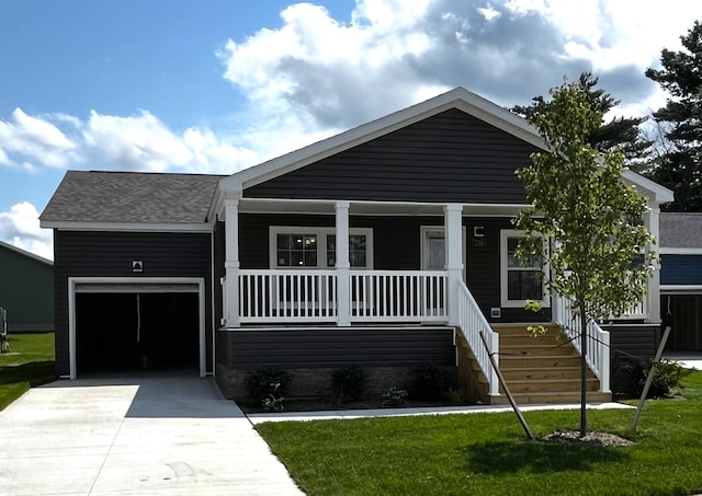 view of front of house featuring a front lawn, a porch, and a garage