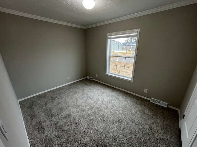 spare room with dark colored carpet, crown molding, and a textured ceiling