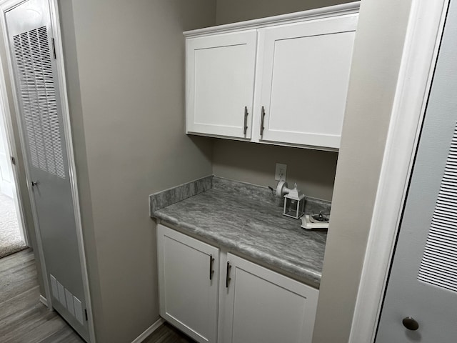 laundry room featuring hardwood / wood-style flooring