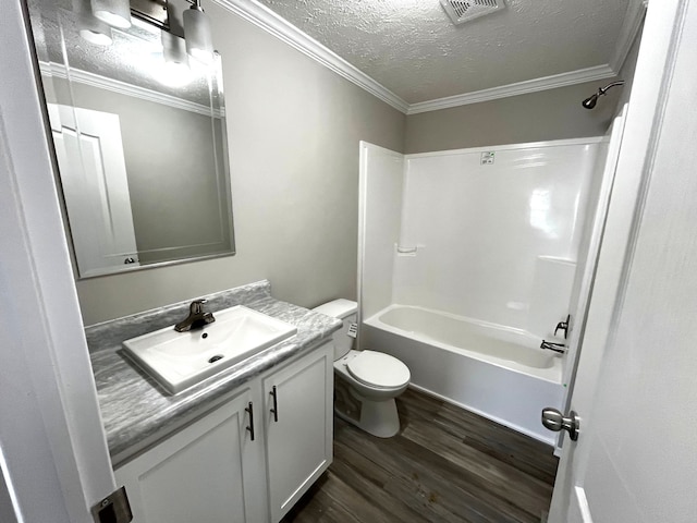 full bathroom with hardwood / wood-style floors, vanity, ornamental molding, and tub / shower combination