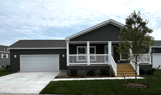 view of front facade featuring central air condition unit, a front lawn, covered porch, and a garage