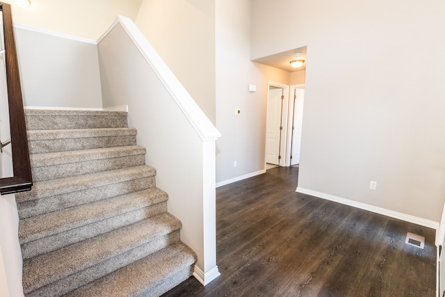 staircase featuring hardwood / wood-style flooring