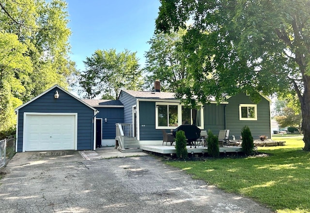 view of front of house featuring a deck and a front lawn