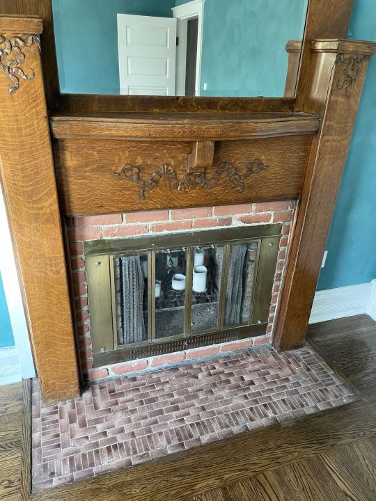 room details with hardwood / wood-style flooring and a brick fireplace