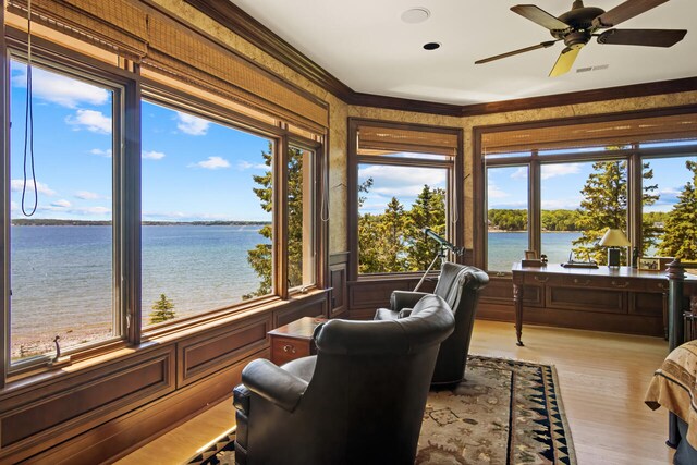7545 Oyster Bay Dr Unit 4, Charlevoix, MI 49720 - sunroom / solarium featuring a water view, wood finished floors, and crown molding