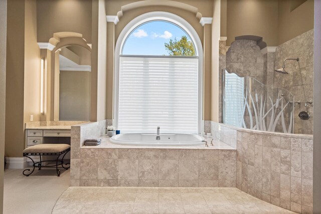 7545 Oyster Bay Dr Unit 4, Charlevoix, MI 49720 - bathroom with a garden tub, walk in shower, and vanity