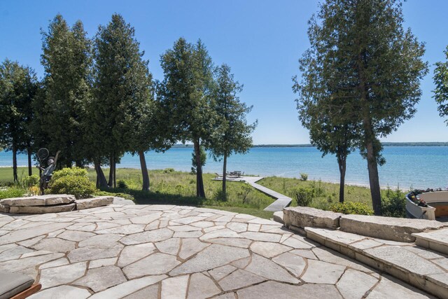 7545 Oyster Bay Dr Unit 4, Charlevoix, MI 49720 - view of patio / terrace with a water view