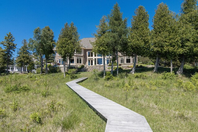 7545 Oyster Bay Dr Unit 4, Charlevoix, MI 49720 - view of rear view of property