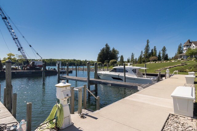 7545 Oyster Bay Dr Unit 4, Charlevoix, MI 49720 - dock area featuring a water view