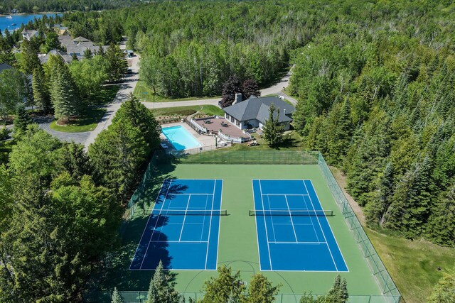 7545 Oyster Bay Dr Unit 4, Charlevoix, MI 49720 - aerial view of a heavily wooded area and a pool area