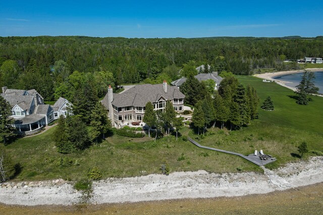 7545 Oyster Bay Dr Unit 4, Charlevoix, MI 49720 - aerial overview of property's location featuring a heavily wooded area