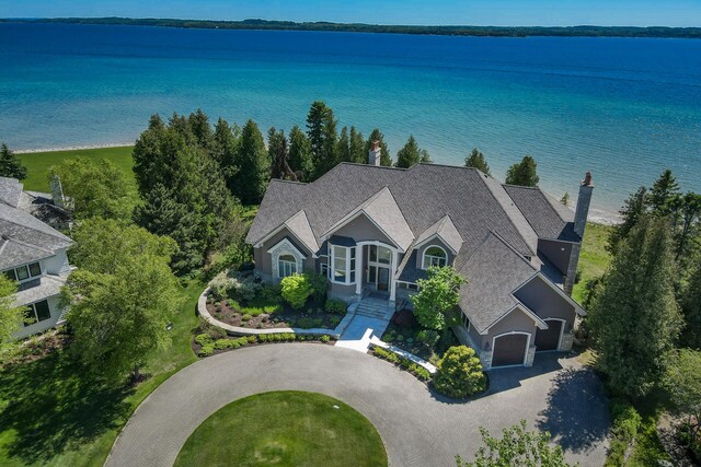 7545 Oyster Bay Dr Unit 4, Charlevoix, MI 49720 - view of subject property with a nearby body of water