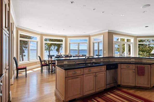 7545 Oyster Bay Dr Unit 4, Charlevoix, MI 49720 - kitchen featuring stainless steel dishwasher, a sink, wood finished floors, a water view, and crown molding