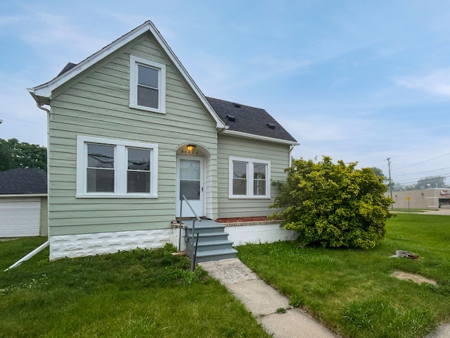 bungalow-style home featuring a front yard