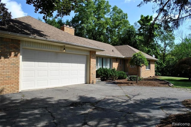 single story home featuring a garage