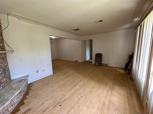 unfurnished living room featuring light hardwood / wood-style floors