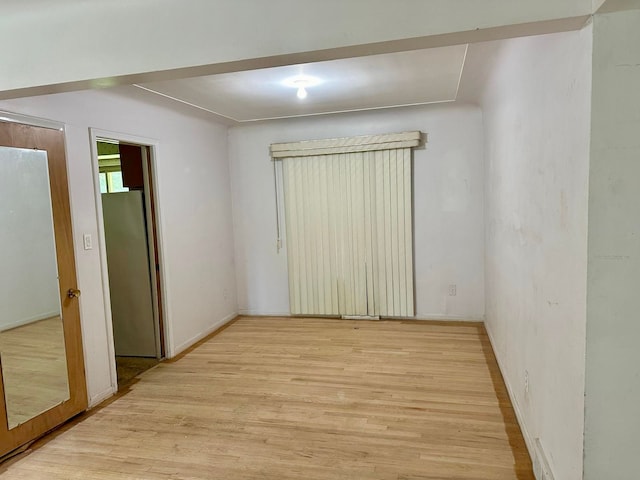 unfurnished room featuring light hardwood / wood-style floors