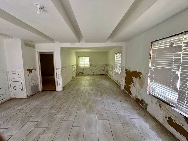 unfurnished room with light wood-type flooring