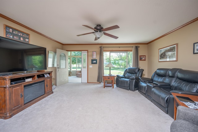 living room featuring light carpet, ceiling fan, and ornamental molding