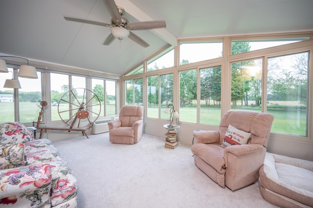 sunroom featuring vaulted ceiling with beams and ceiling fan