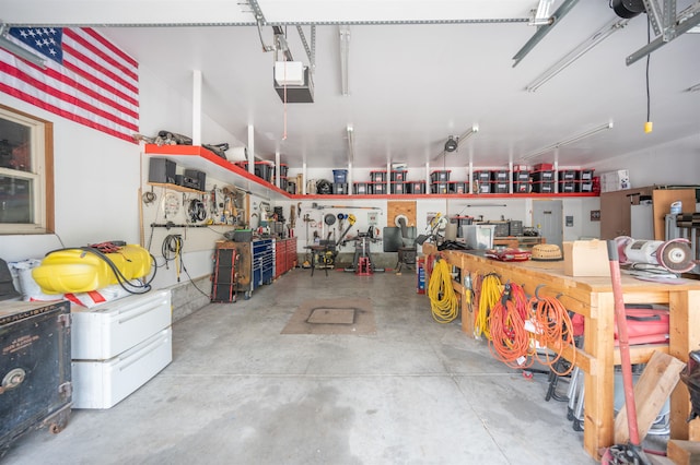 garage featuring a workshop area and a garage door opener