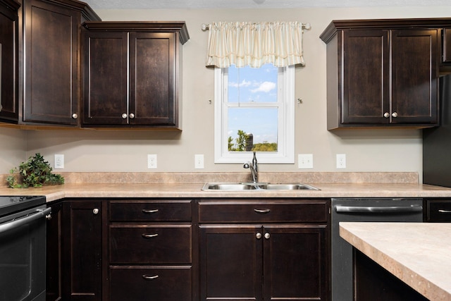 kitchen featuring dark brown cabinets, sink, and stainless steel appliances