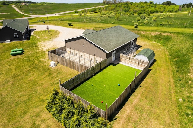 birds eye view of property with a rural view